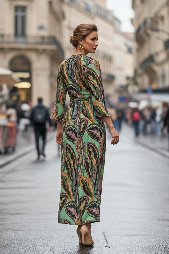 green leaf print dress, sustainable silk gown, Shahida Parides, long sleeve wrap dress, flowy silhouette, eco chic fashion, high slit gown, resort fashion, modern luxury dress