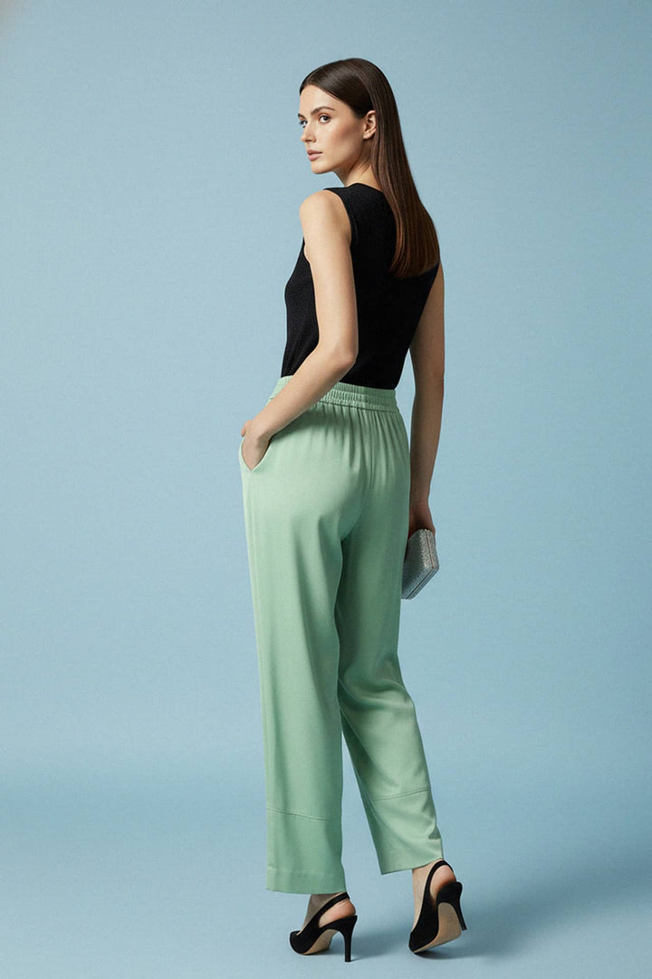 shahida parides fashion, mint flow pants, pastel green trousers, breezy summer wear, elegant back angle