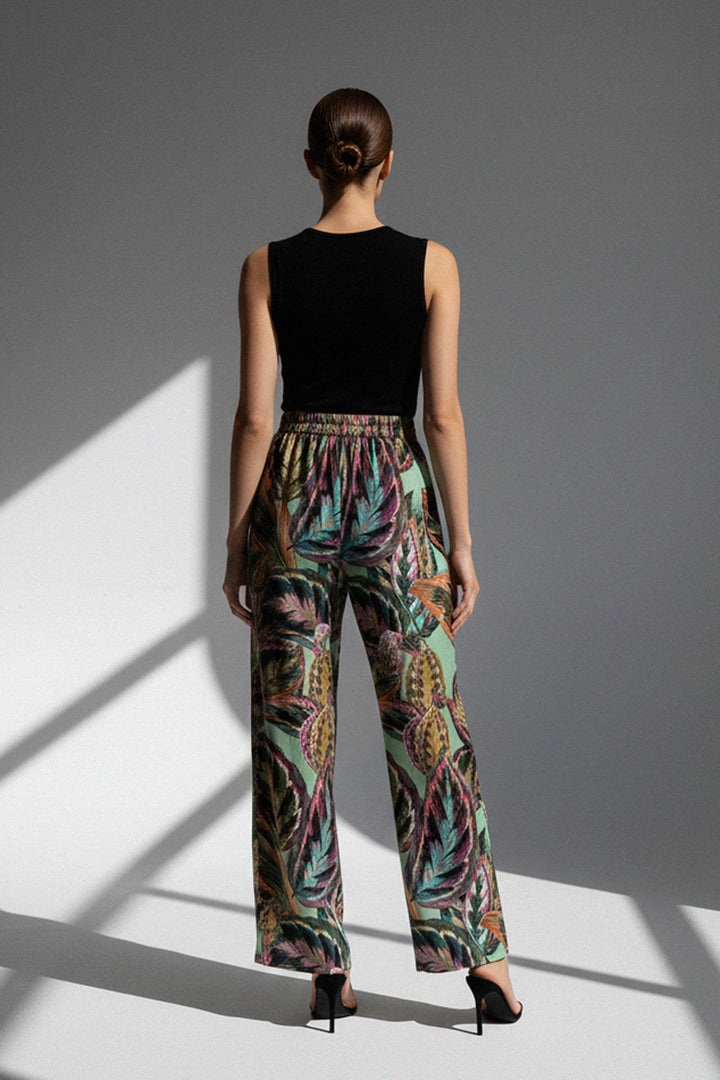 multi leaf print, elegant trousers, high fashion look, patterned outfit, stylish coordination, garden backdrop