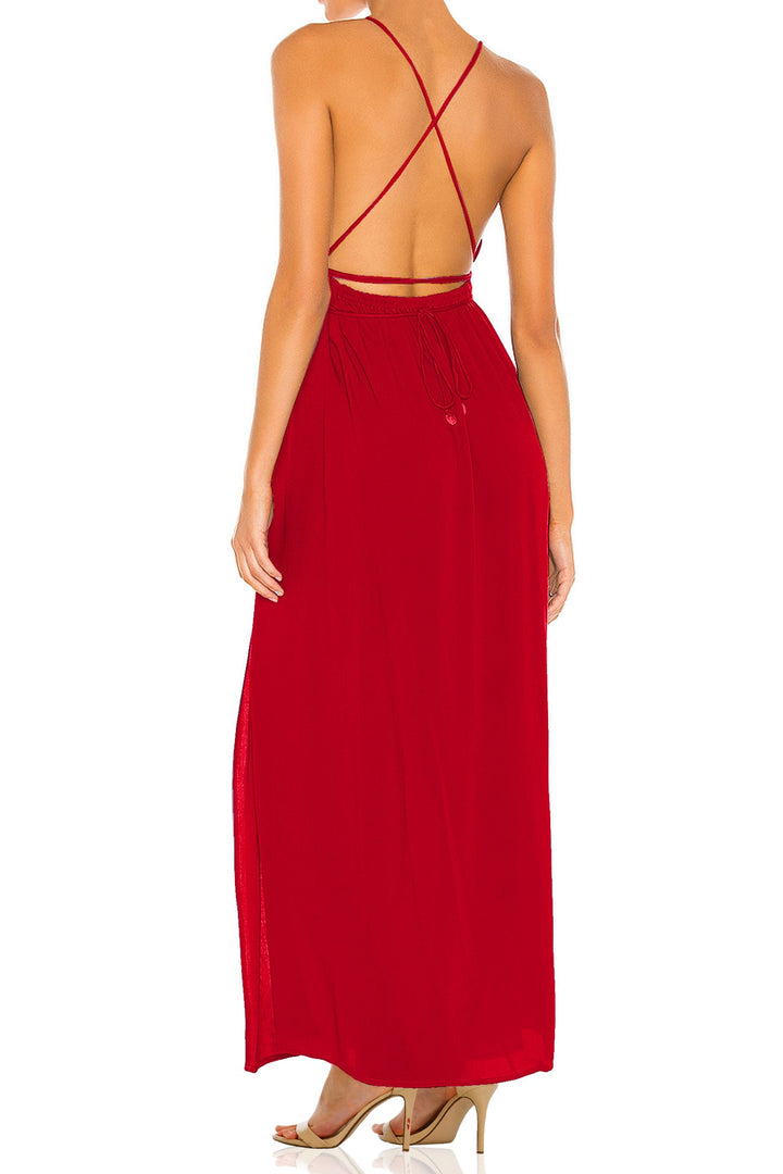  a plunging neckline and front slit, ideal for evening events or luxury resort wear.