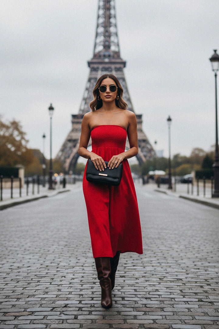 Elegant red strapless midi dress styled in Paris near the Eiffel Tower, perfect for travel and evening wear.