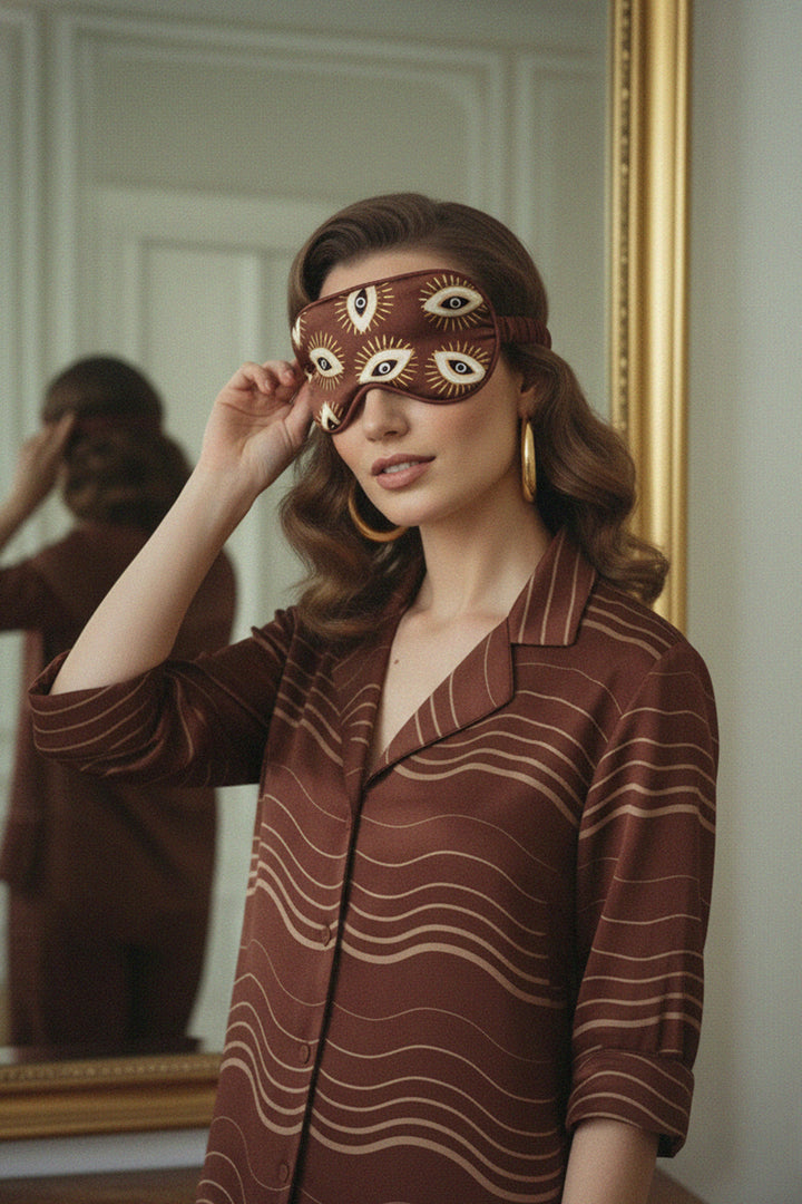 silk eye mask, pajama fashion, chic sleep attire, soft brown tones, designer accessory