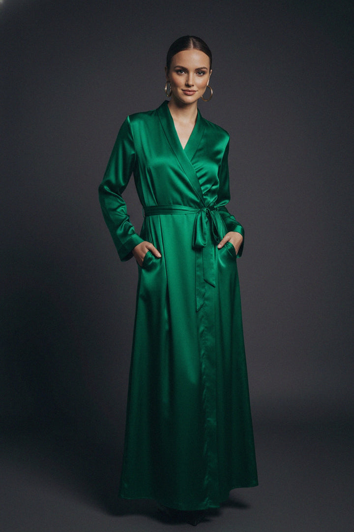 Kyle X Shahida, emerald silk gown, wrap maxi dress, green long dress, luxury fashion, belted waist style, elegant silhouette, evening outfit, satin texture, women’s formalwear, chic fashion, sophisticated look