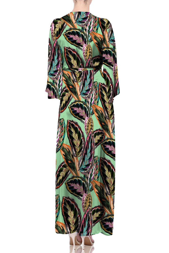 sustainable silk, leaf print dress, green wrap gown, Shahida Parides, Kyle Richards collection, eco luxury, designer fashion, resort elegance, flowy silhouette, tropical chic, feminine style, luxury couture